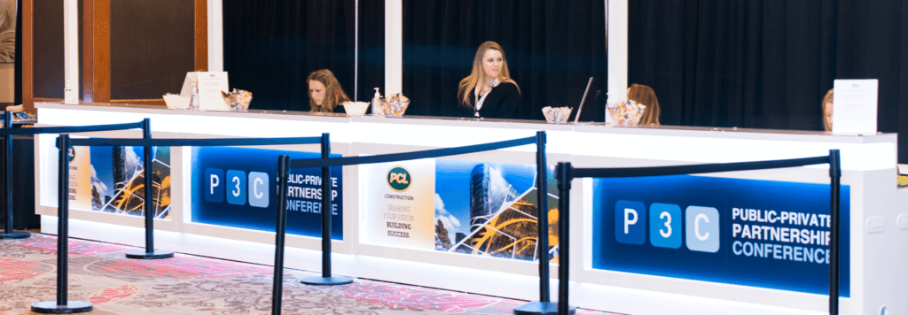 Employees working at a registration desk